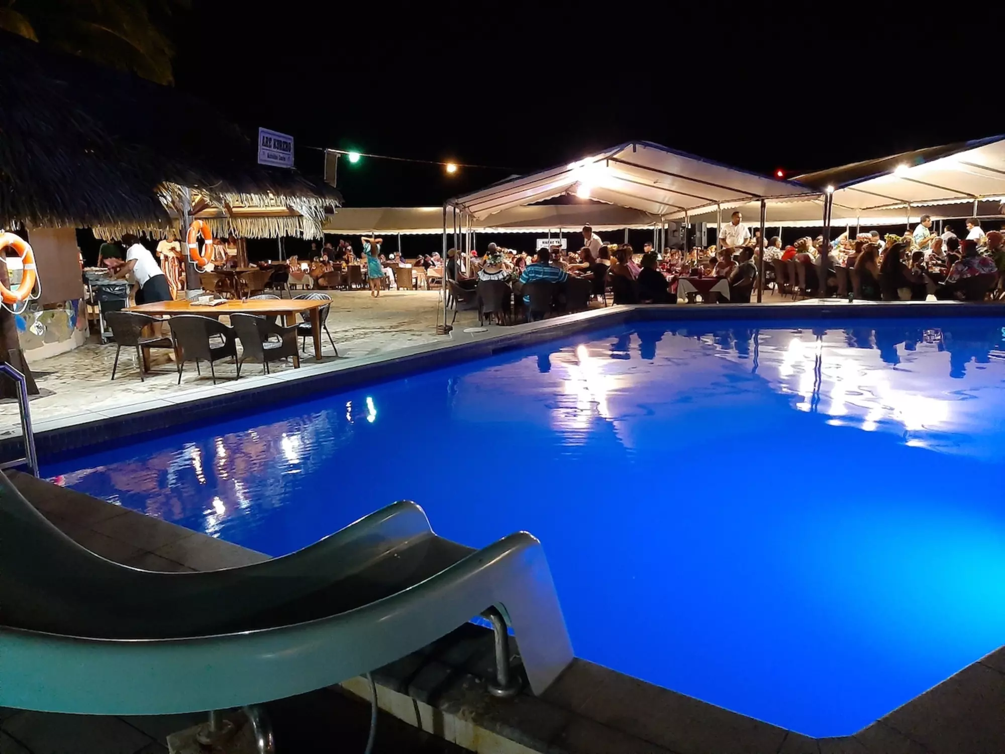 Pool view at night at The Brasserie Restaurant at Edgewater Resort & Spa