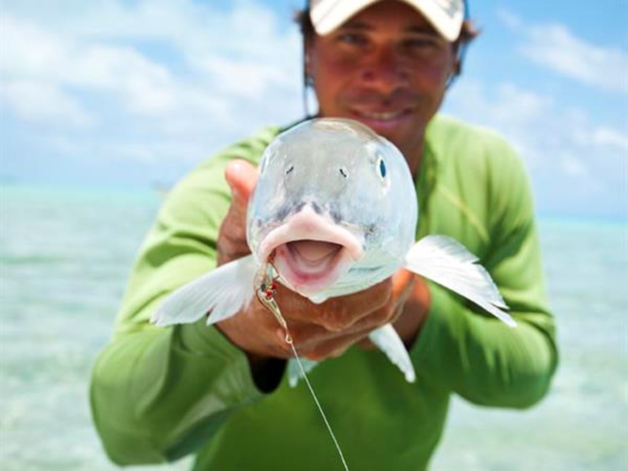 man holds fish