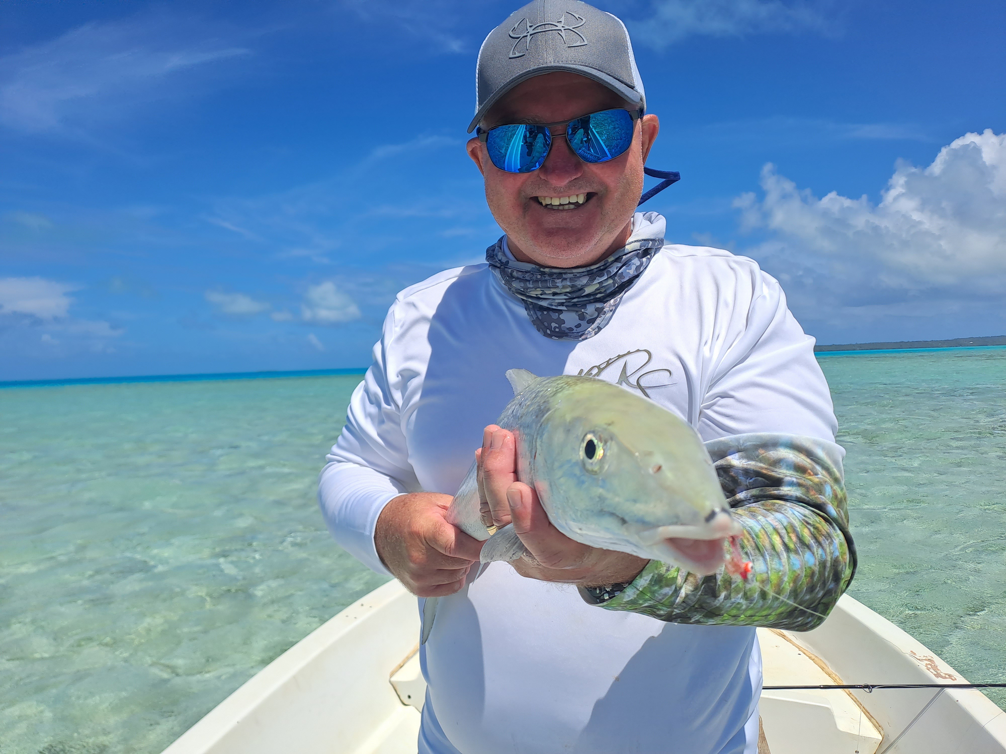 Bonefish charter - fisherman holding catch