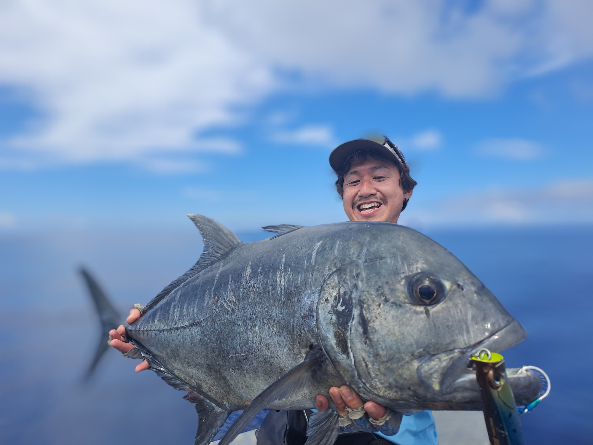 Bonefish charter - fisherman holding catch