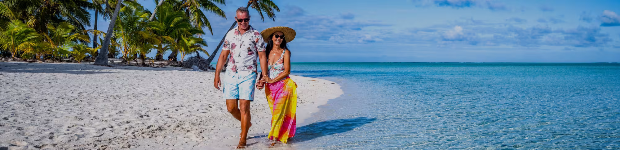 A couple walking along the beach