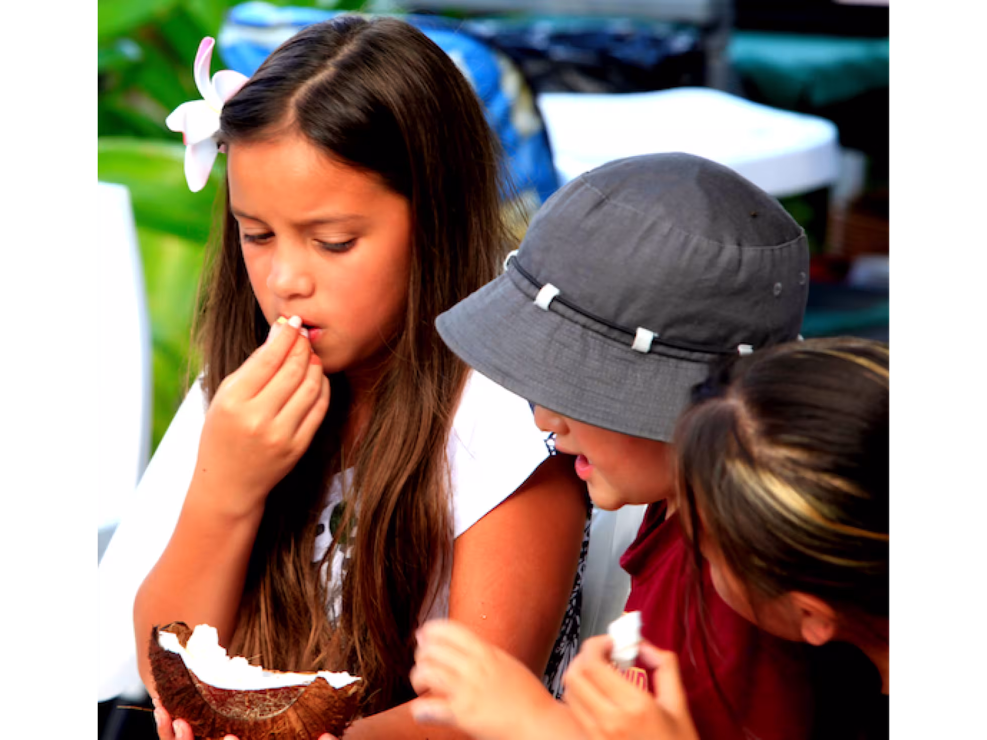 Child eating coconut at The Brasserie Restaurant at Edgewater Resort & Spa