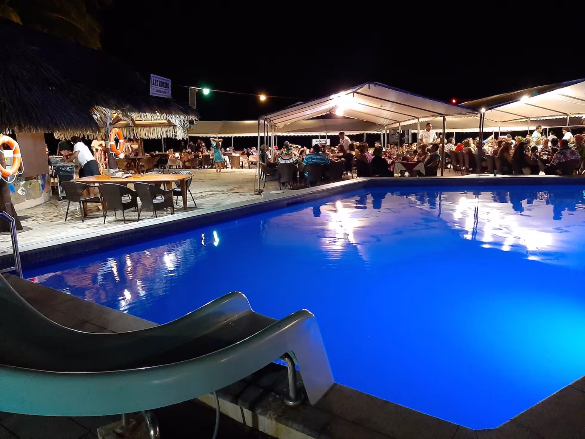 Pool view at night at The Brasserie Restaurant at Edgewater Resort & Spa