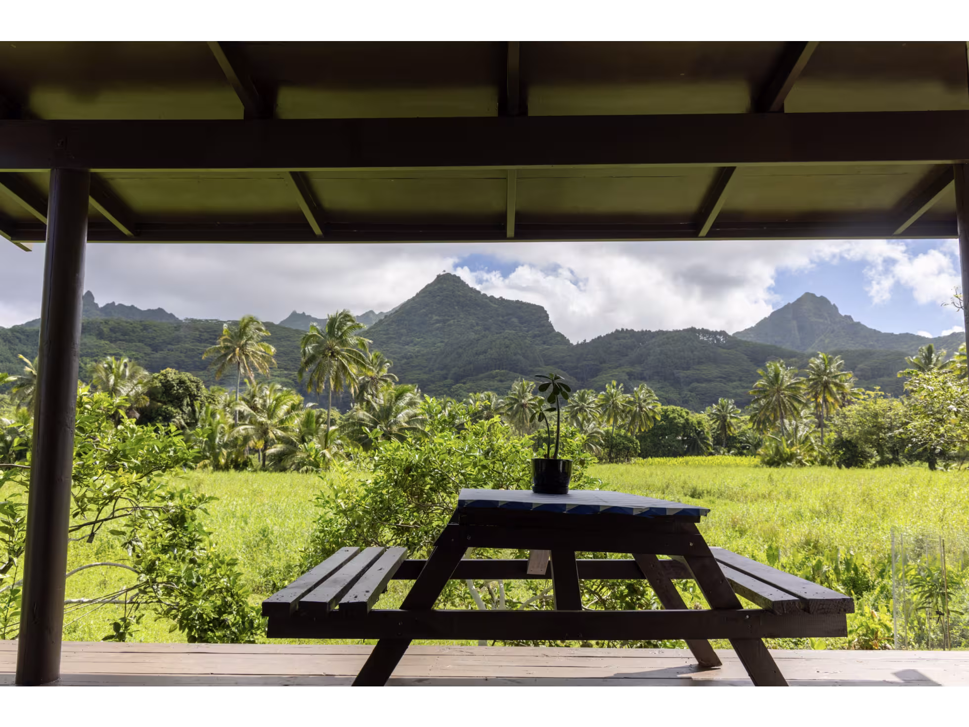View of a picnic bench and mountains in the background